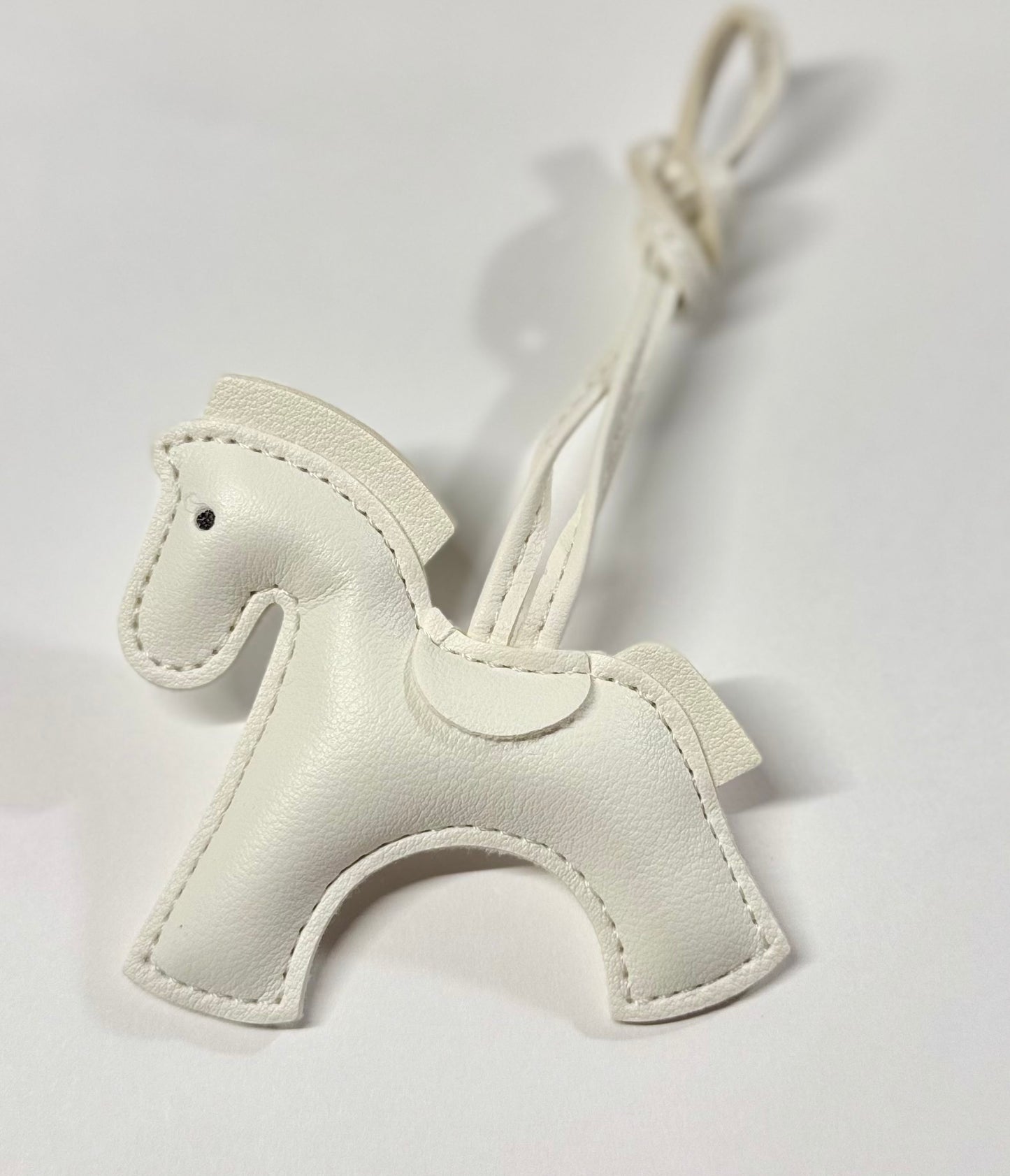 Grey bag charm